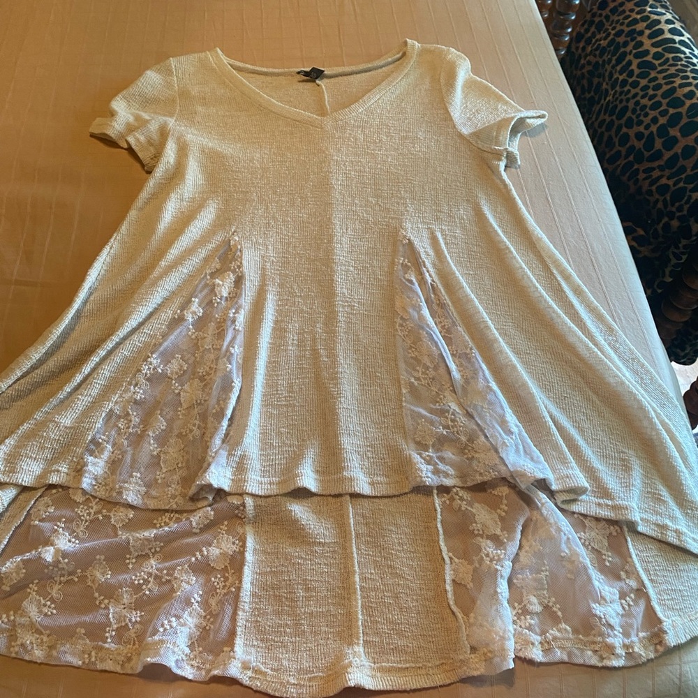 Women’s beige knit top with ivory lace cutouts